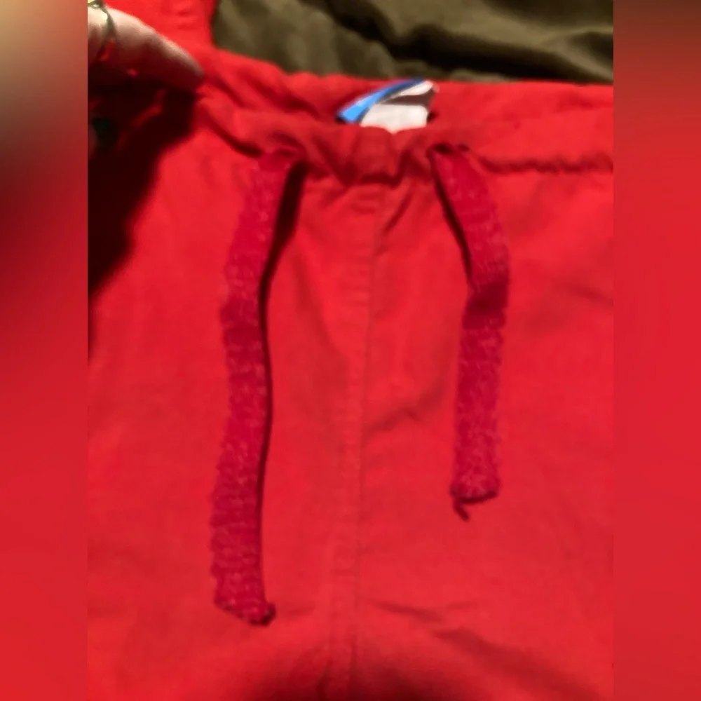 Red Ohio State Buckeyes scrub pants, size medium, small stain under pocket